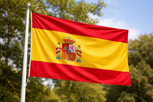 Spanish flag with coat of arms against a natural background